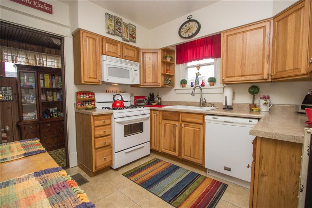 307 Darlington Road Beaver Falls, PA 15010 - Photo 3 of 21 This newer kitchen offers oak cabinets, a dishwasher and microwave and plenty of counter space! The neutral ceramic tile flooring allows you to accessorize with the colors that fit your style!