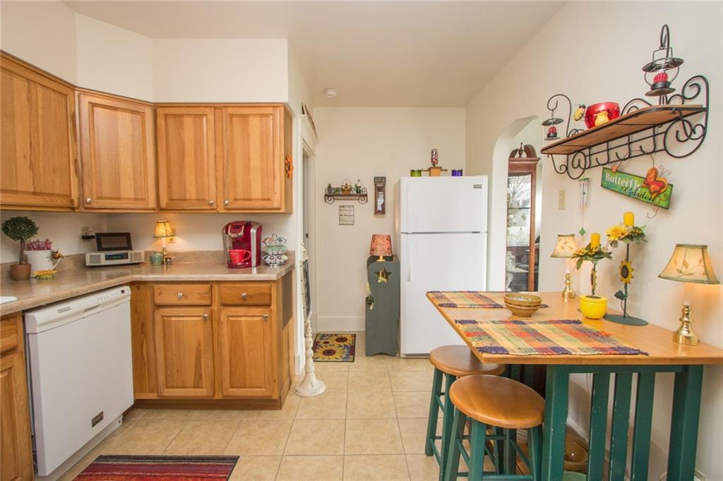 307 Darlington Road Beaver Falls, PA 15010 - Photo 4 of 21 Another view of the kitchen where the sunlight showcases the gleaming cabinets, great breakfast area or additional prep space, delpending on your needs. Mr. & Mrs. Clean live here! Truly a move-in ready home!