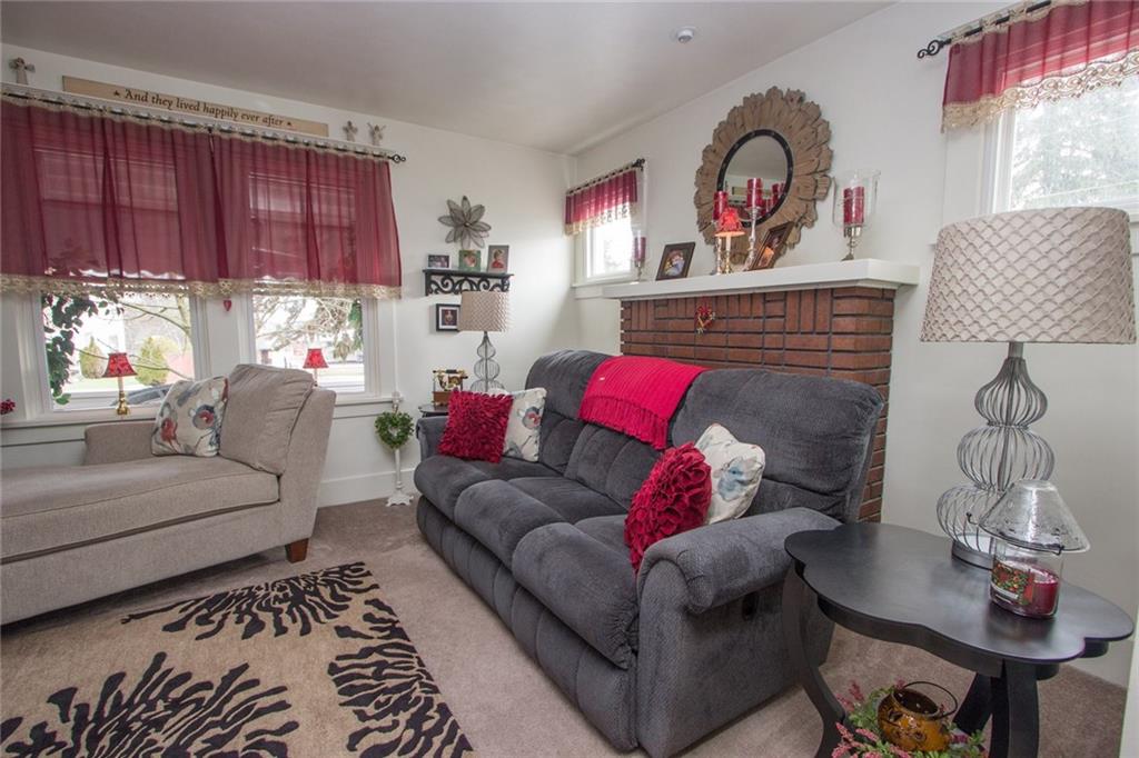 307 Darlington Road Beaver Falls, PA 15010 - Photo 7 of 21 A decorative fireplace, lots of windows and just plain cozy. Creativity with your furniture allows more than enough space for everyone to join in!