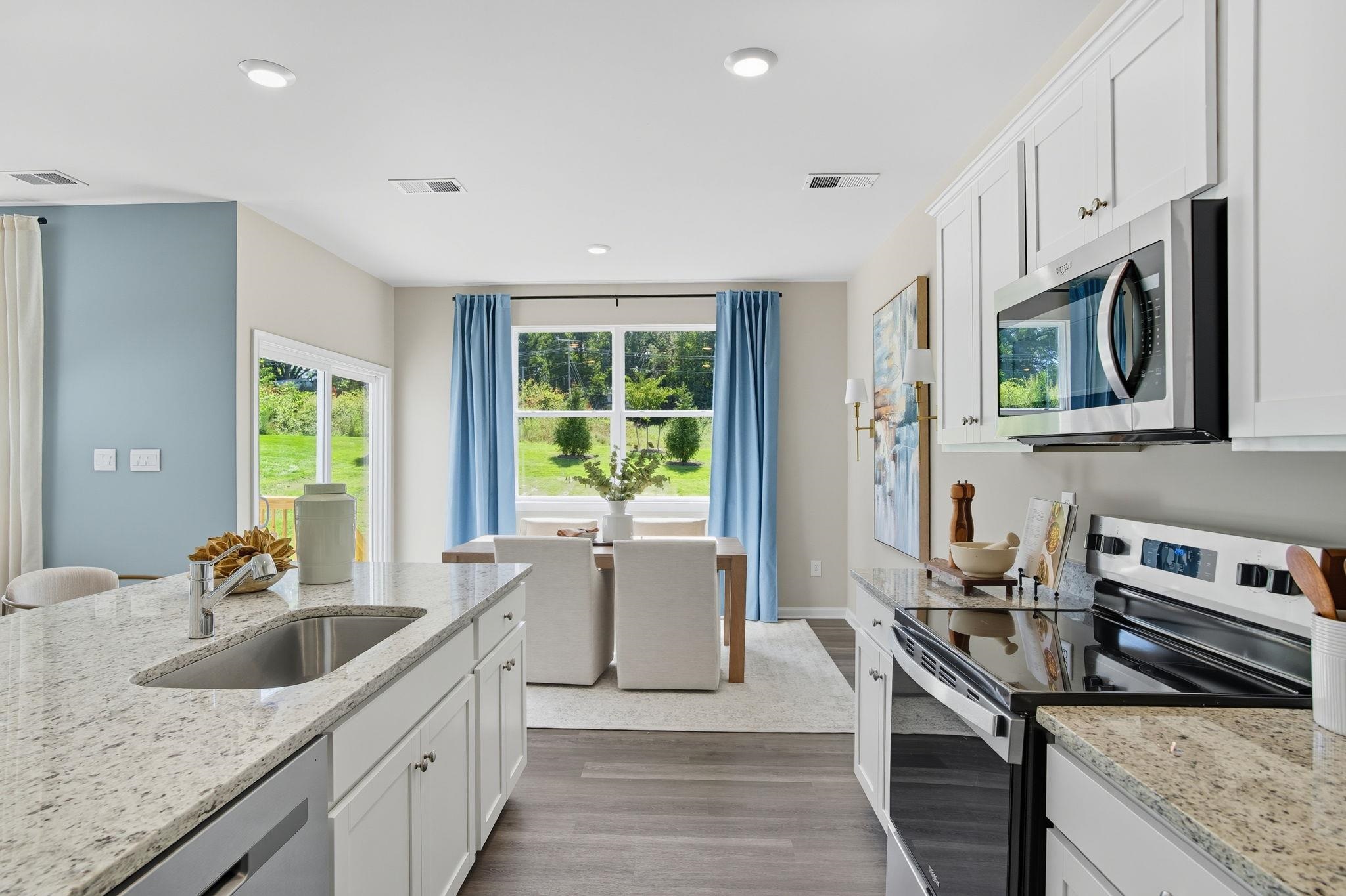 113 Meadow Ridge Way Staunton, VA 24401 - Photo 5 of 30 a kitchen with stainless steel appliances granite countertop a sink stove and refrigerator