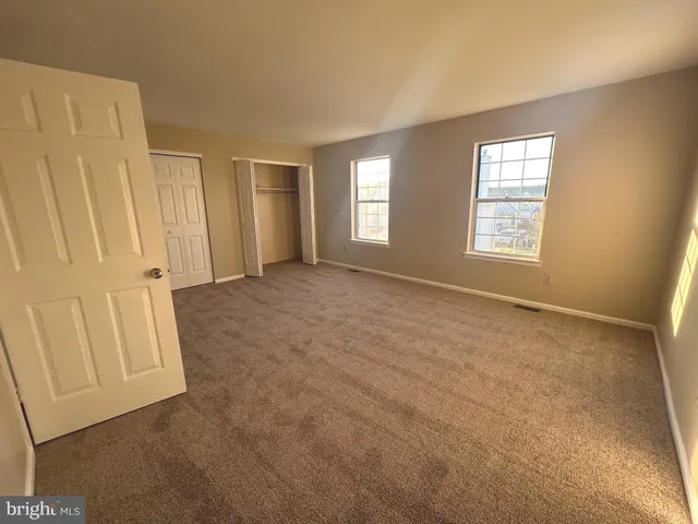 a view of empty room with windows