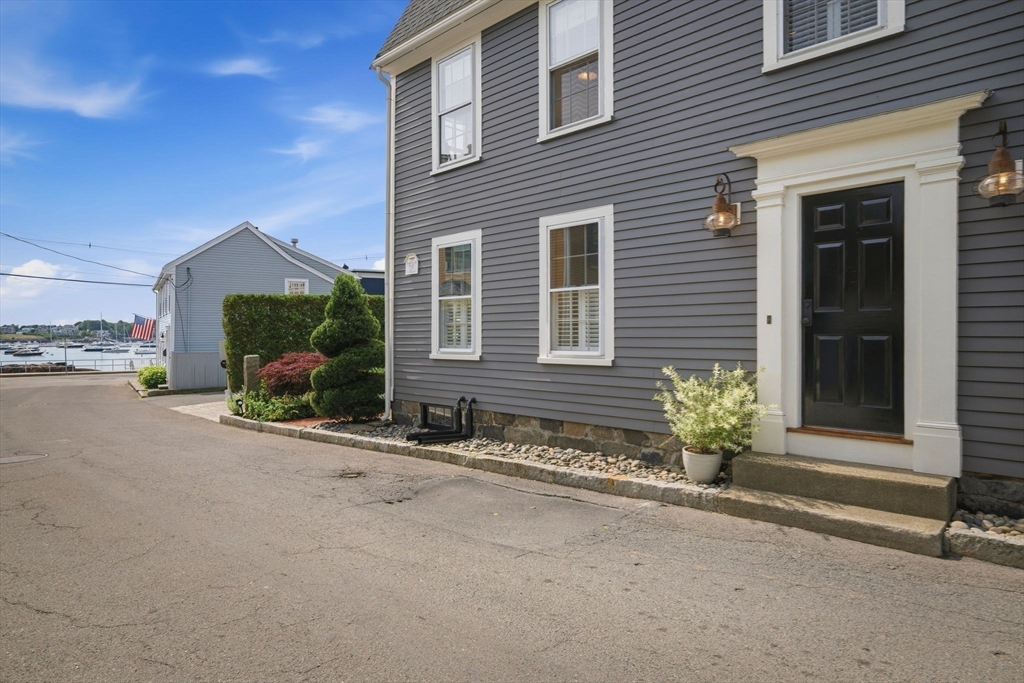 33 Franklin Street Marblehead, MA 01945 - Photo 40 of 42 front view of a house with a yard