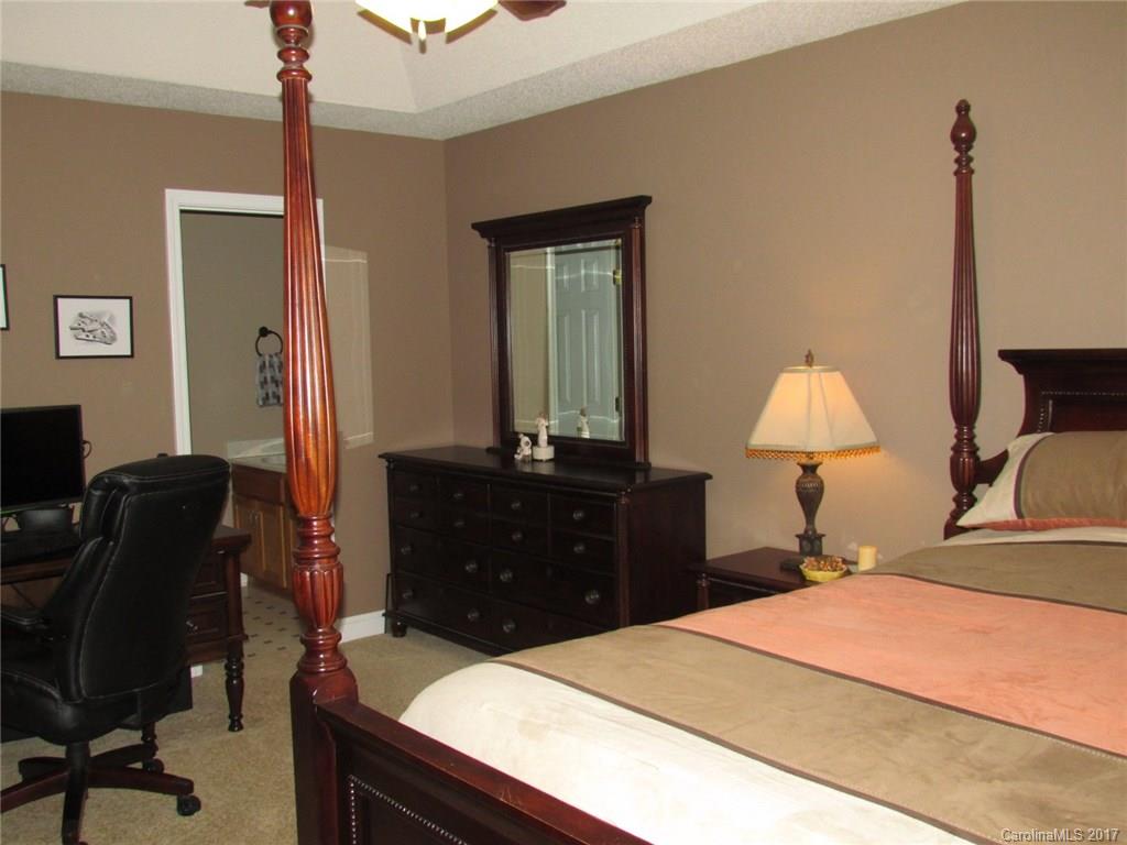 423 Maple Ridge Circle Salisbury, NC 28147 - Photo 14 of 21 a bedroom with a bed and a dresser