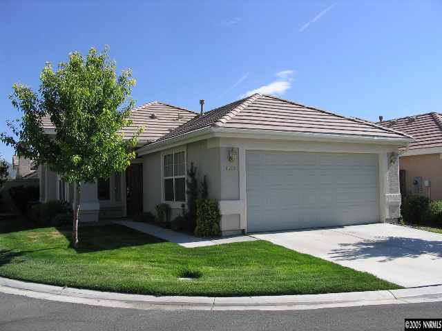 9688 Truckee Meadows Place Reno, NV 89521 - Photo 1 of 4 a front view of a house with a garden