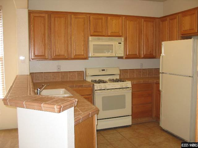 9688 Truckee Meadows Place Reno, NV 89521 - Photo 2 of 4 a utility room with dryer and washer