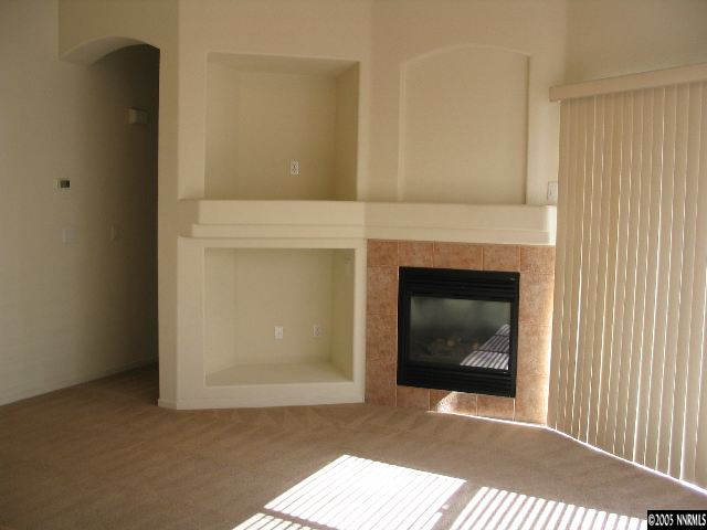 9688 Truckee Meadows Place Reno, NV 89521 - Photo 3 of 4 a view of an empty room with a fireplace