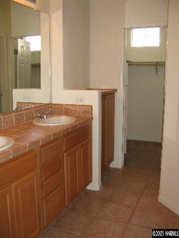 9688 Truckee Meadows Place Reno, NV 89521 - Photo 4 of 4 a bathroom with a sink and a mirror