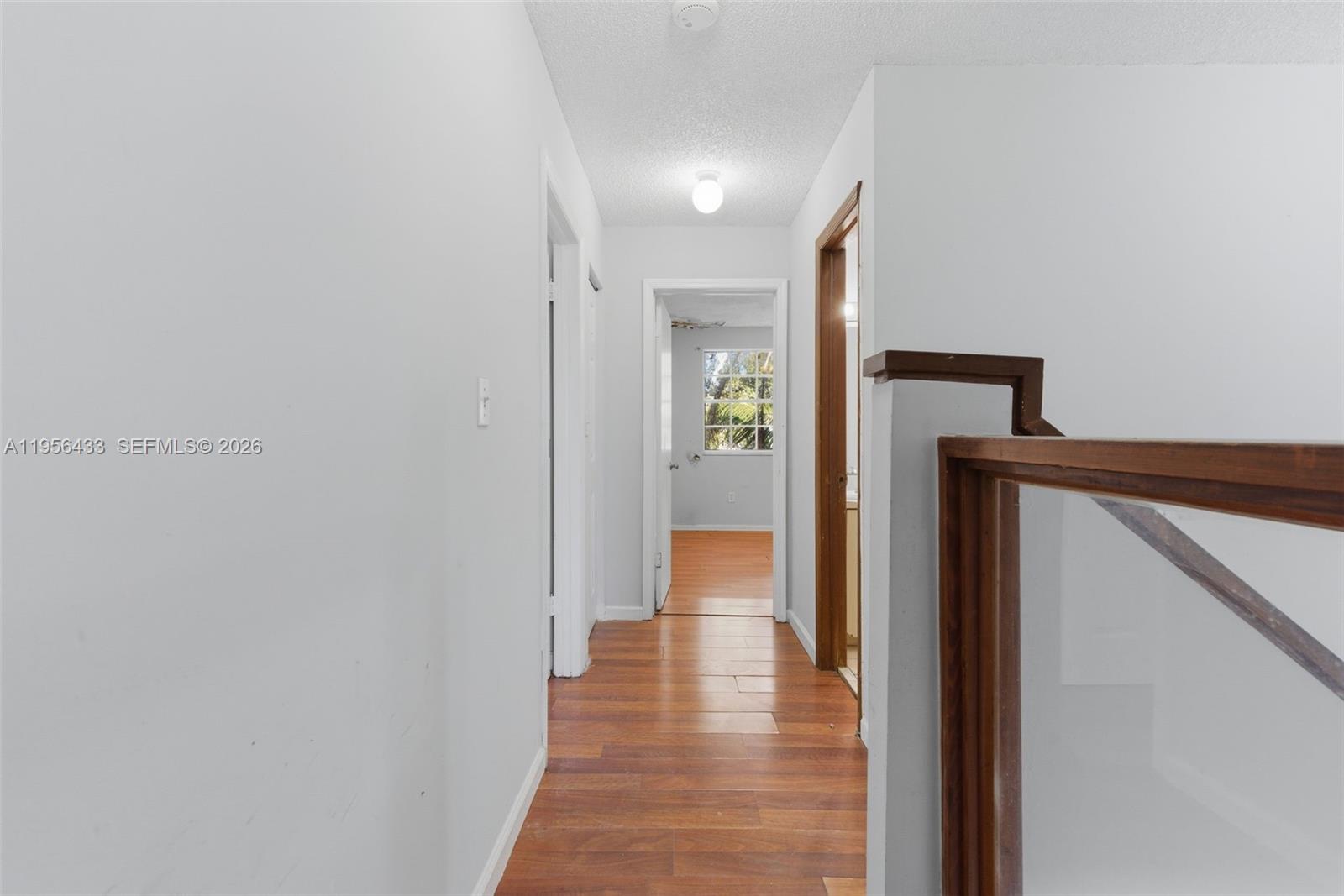 15804 Southwest 112th Terrace Miami, FL 33196 - Photo 30 of 46 a view of a hallway with wooden floor