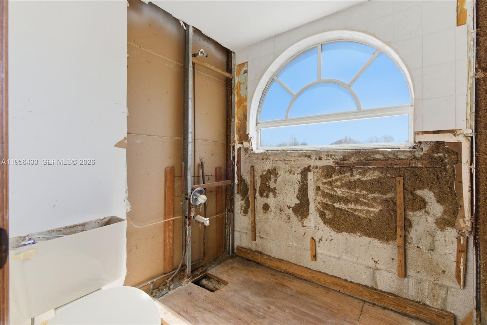 15804 Southwest 112th Terrace Miami, FL 33196 - Photo 34 of 46 a bathroom with a toilet and a shower