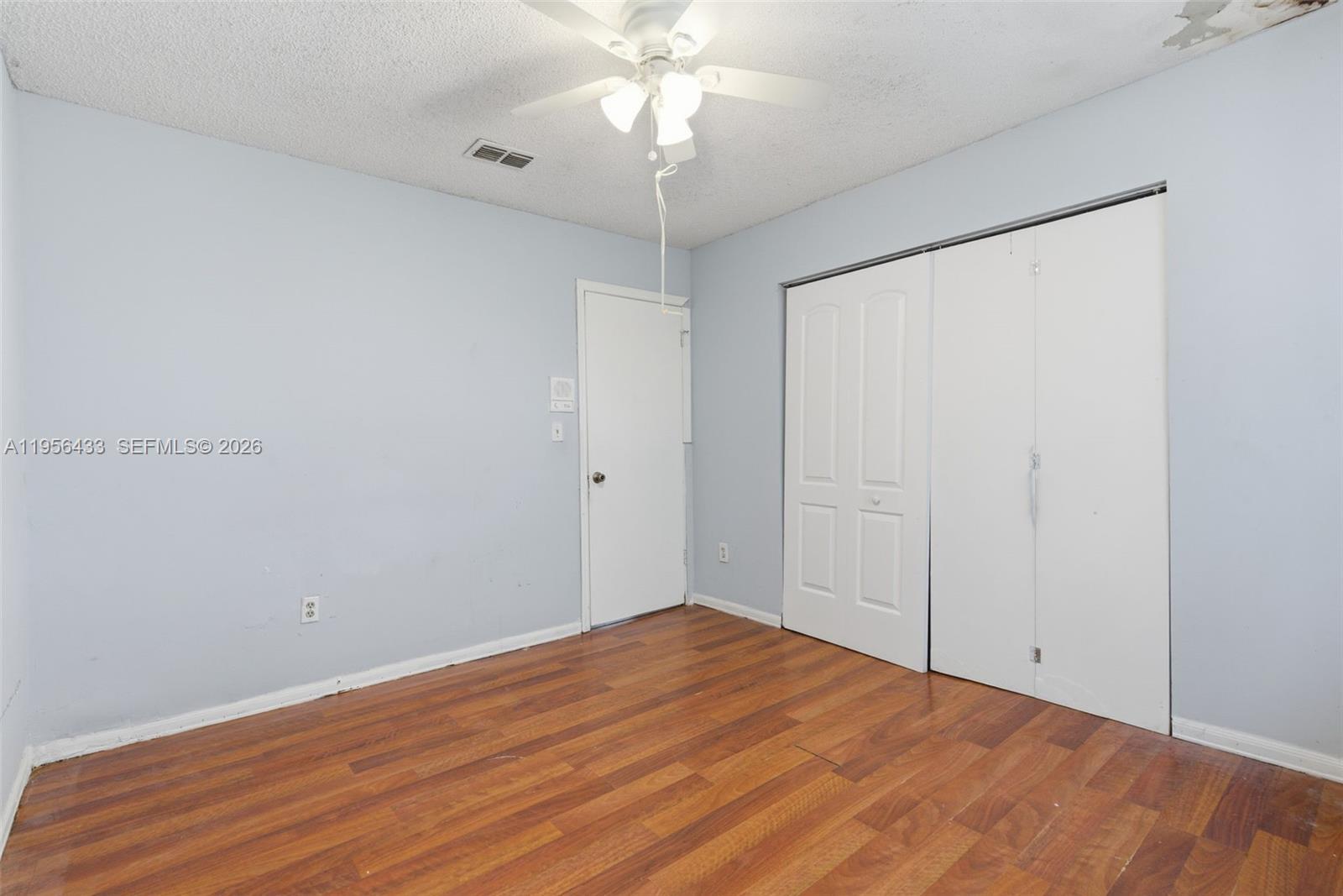 15804 Southwest 112th Terrace Miami, FL 33196 - Photo 36 of 46 a view of empty room with wooden floor