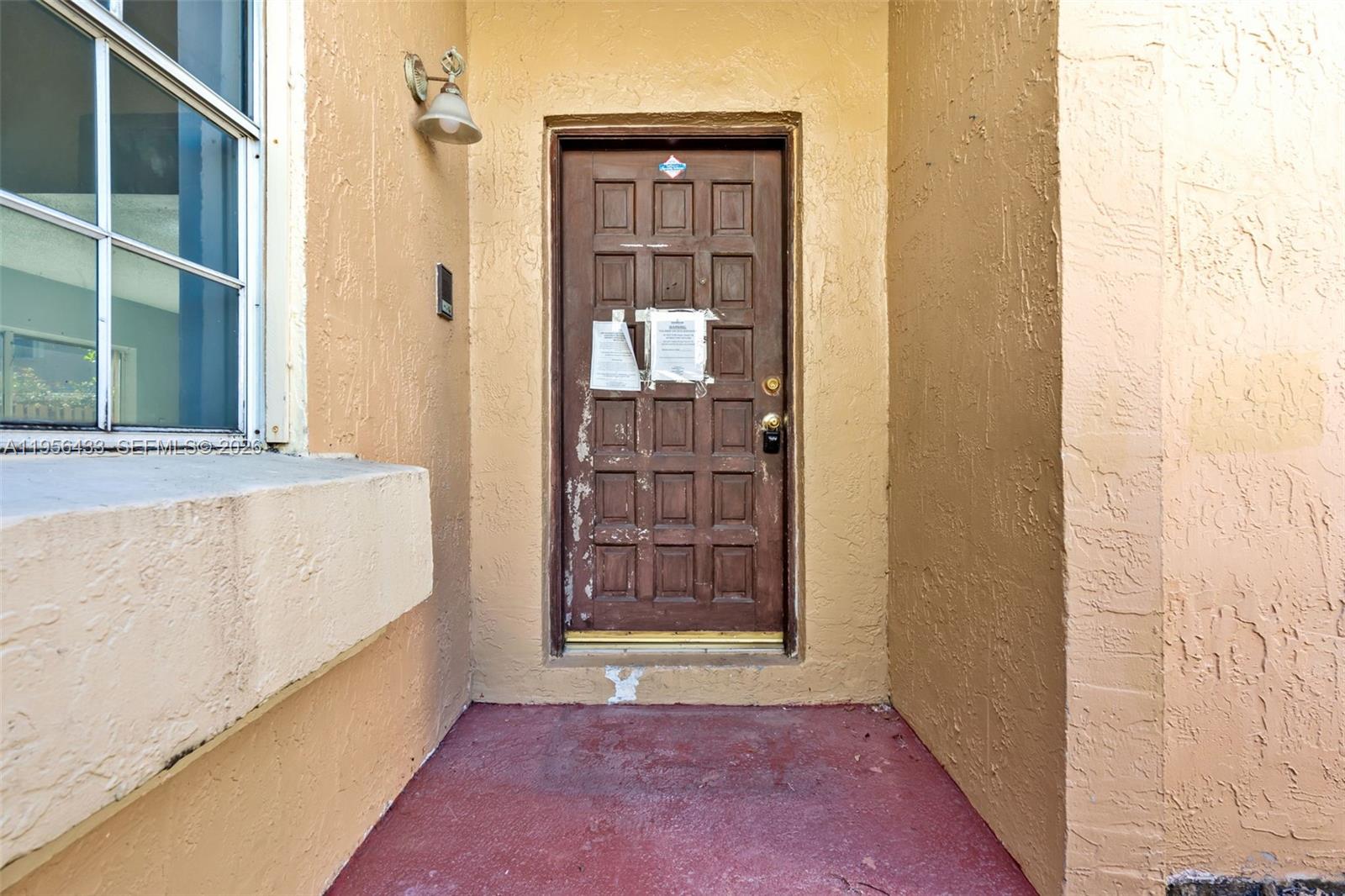 15804 Southwest 112th Terrace Miami, FL 33196 - Photo 4 of 46 a view of front door of house