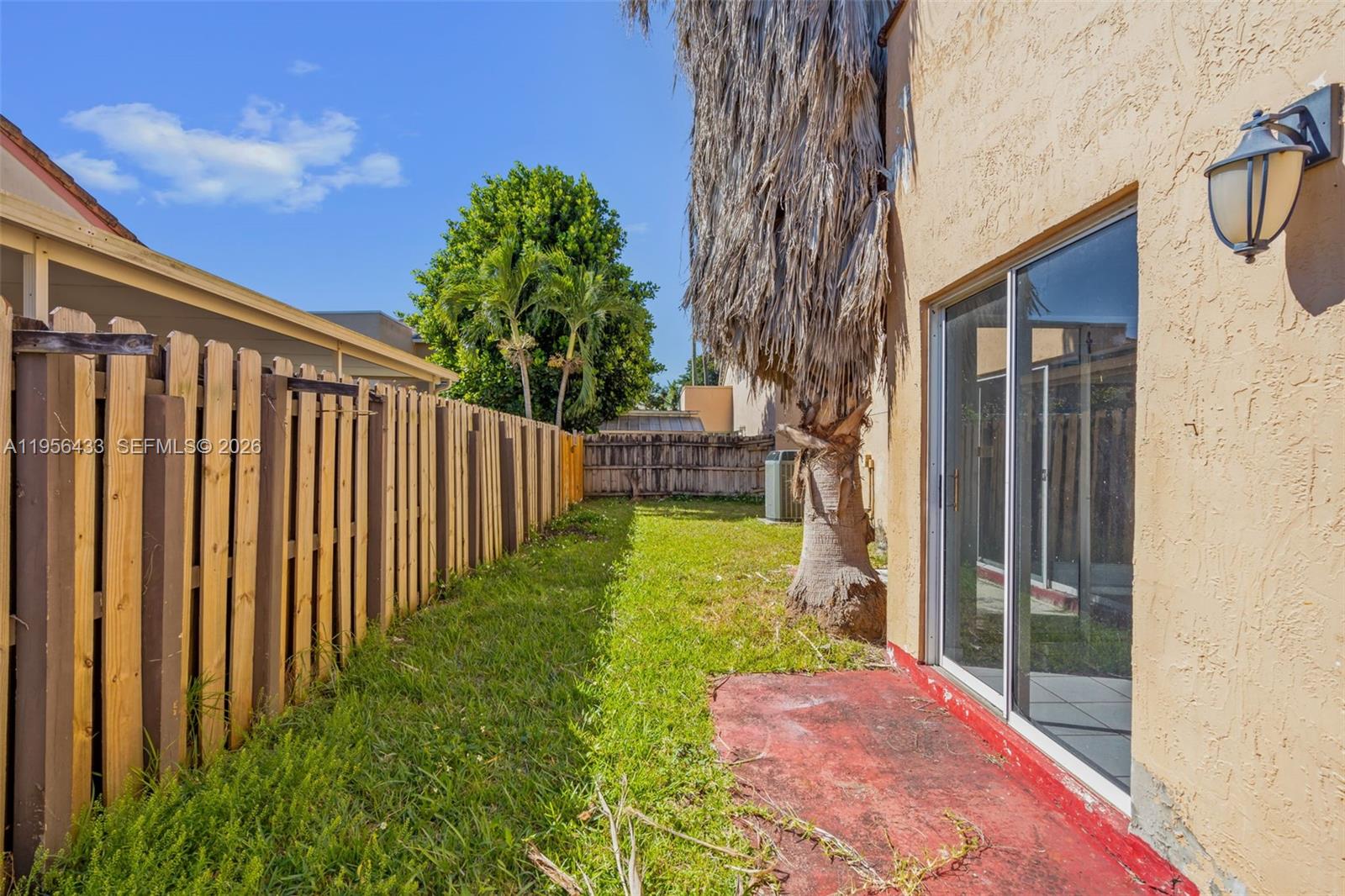 15804 Southwest 112th Terrace Miami, FL 33196 - Photo 42 of 46 a view of a backyard with pathway