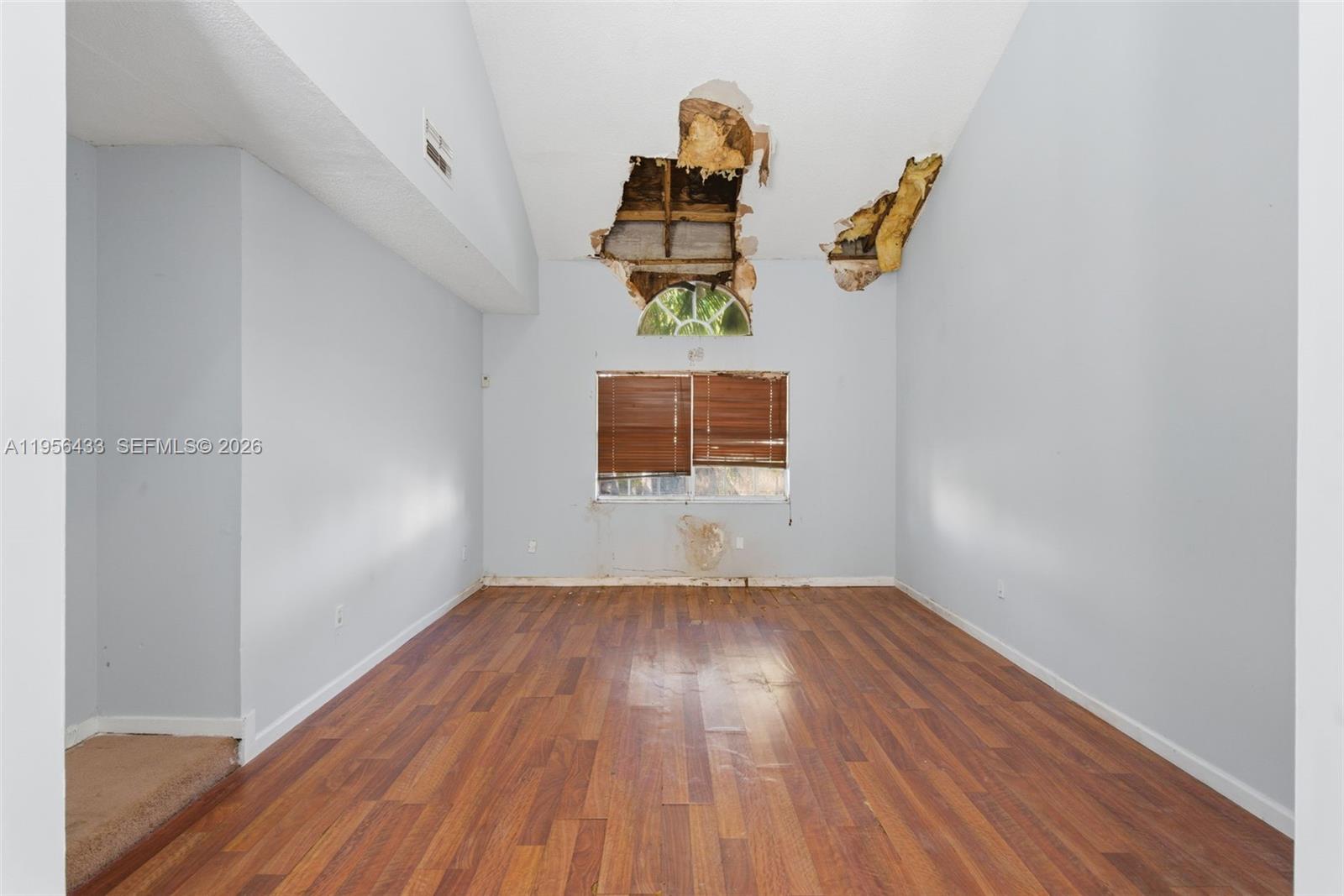 15804 Southwest 112th Terrace Miami, FL 33196 - Photo 6 of 46 a view of empty room with wooden floor
