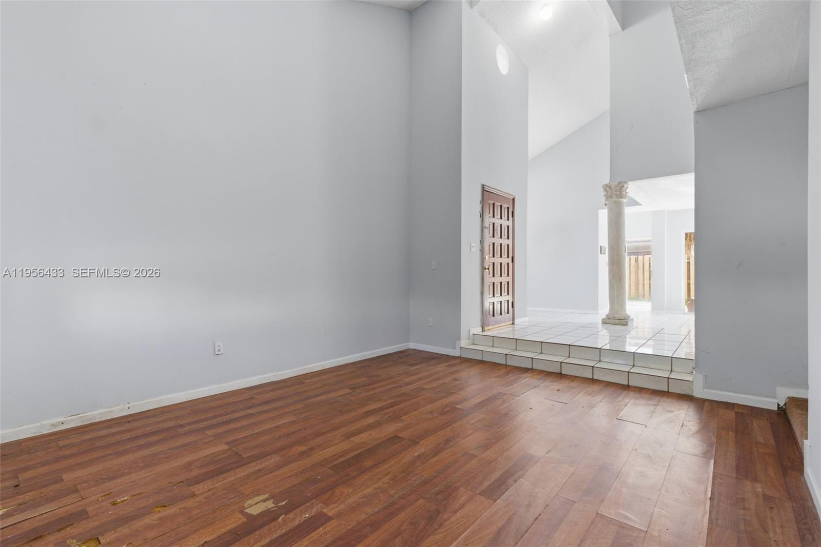 15804 Southwest 112th Terrace Miami, FL 33196 - Photo 7 of 46 a view of wooden floor and window in a room