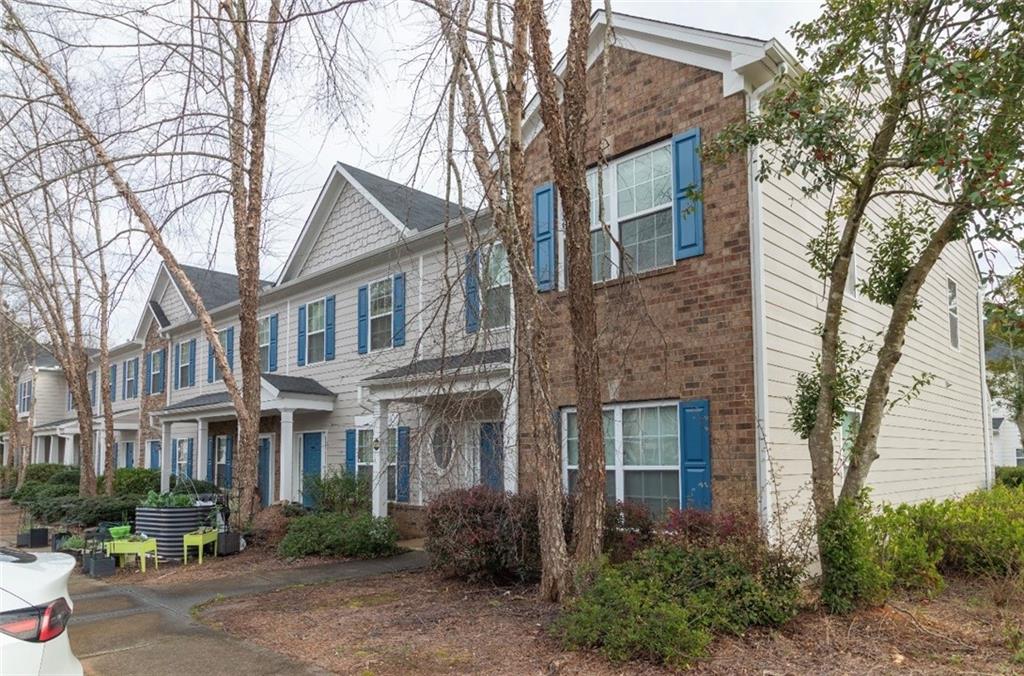 585 McWilliams Road Southeast, Unit 2301 Atlanta, GA 30315 - Photo 12 of 15 a front view of a residential houses with yard and trees