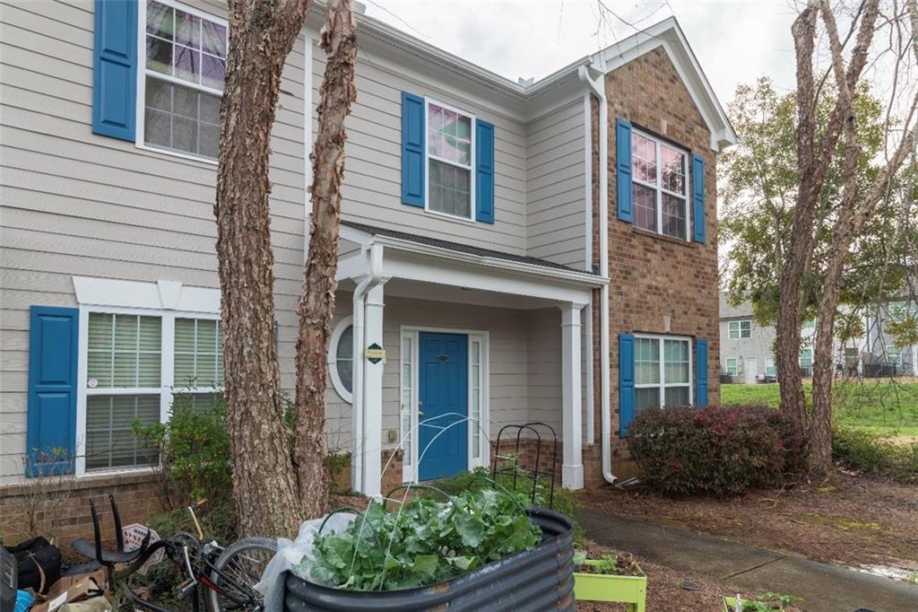585 McWilliams Road Southeast, Unit 2301 Atlanta, GA 30315 - Photo 13 of 15 a view of a house with a yard and plants