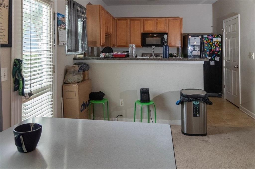 585 McWilliams Road Southeast, Unit 2301 Atlanta, GA 30315 - Photo 14 of 15 a kitchen with a refrigerator and a sink