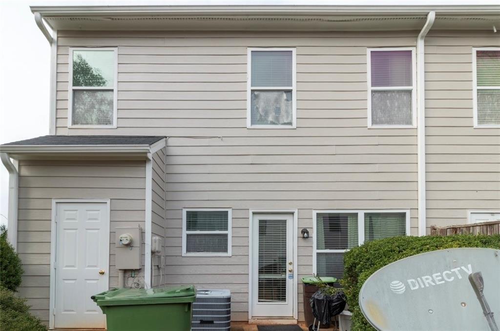 585 McWilliams Road Southeast, Unit 2301 Atlanta, GA 30315 - Photo 15 of 15 a front view of a house with a garden
