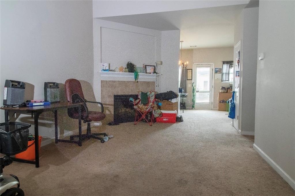 585 McWilliams Road Southeast, Unit 2301 Atlanta, GA 30315 - Photo 4 of 15 a view of a livingroom with workspace and a window