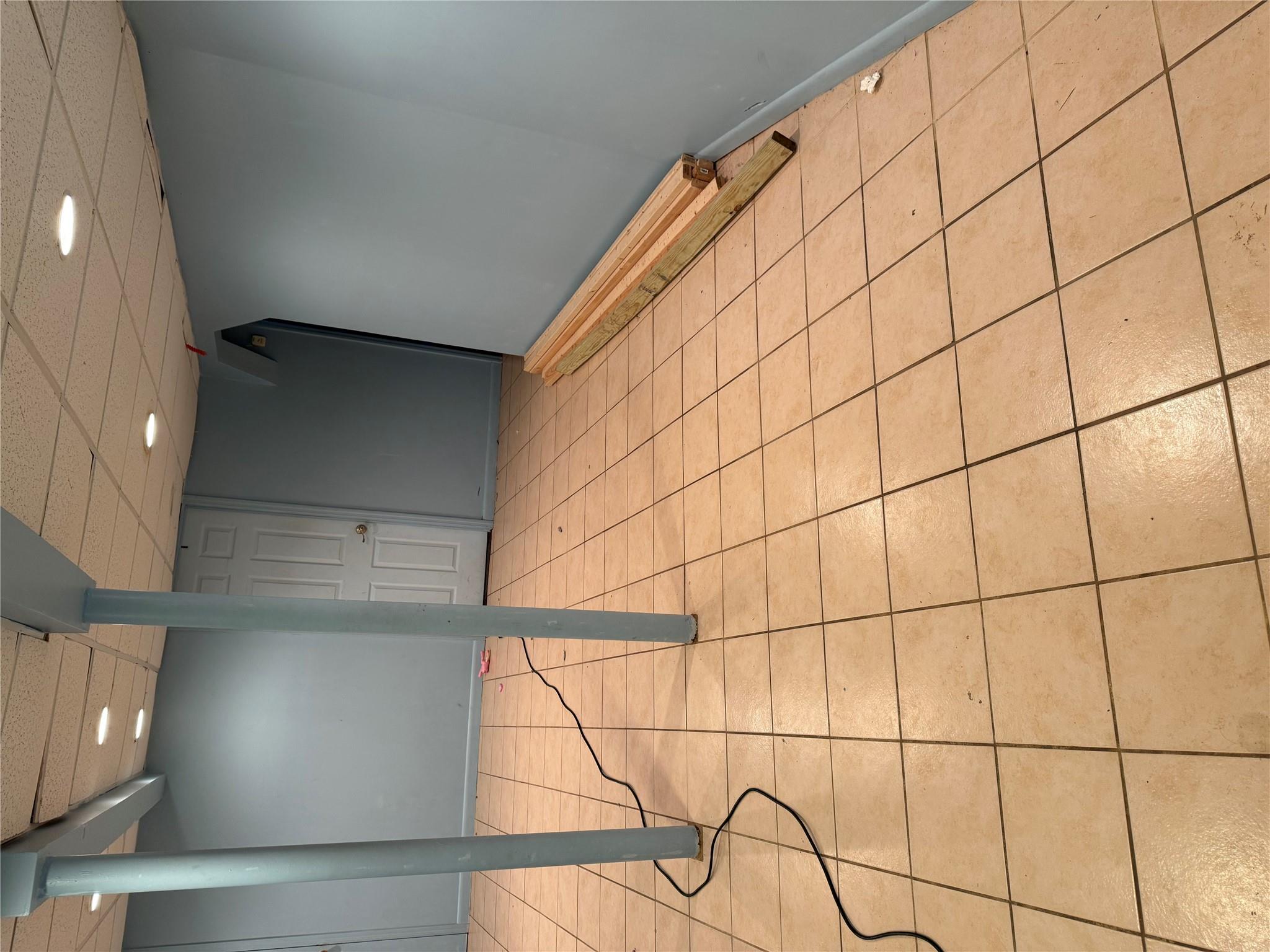 77 Upper Road Middletown, NY 10940 - Photo 14 of 18 Finished basement with a paneled ceiling, recessed lighting, light tile patterned flooring, and baseboards