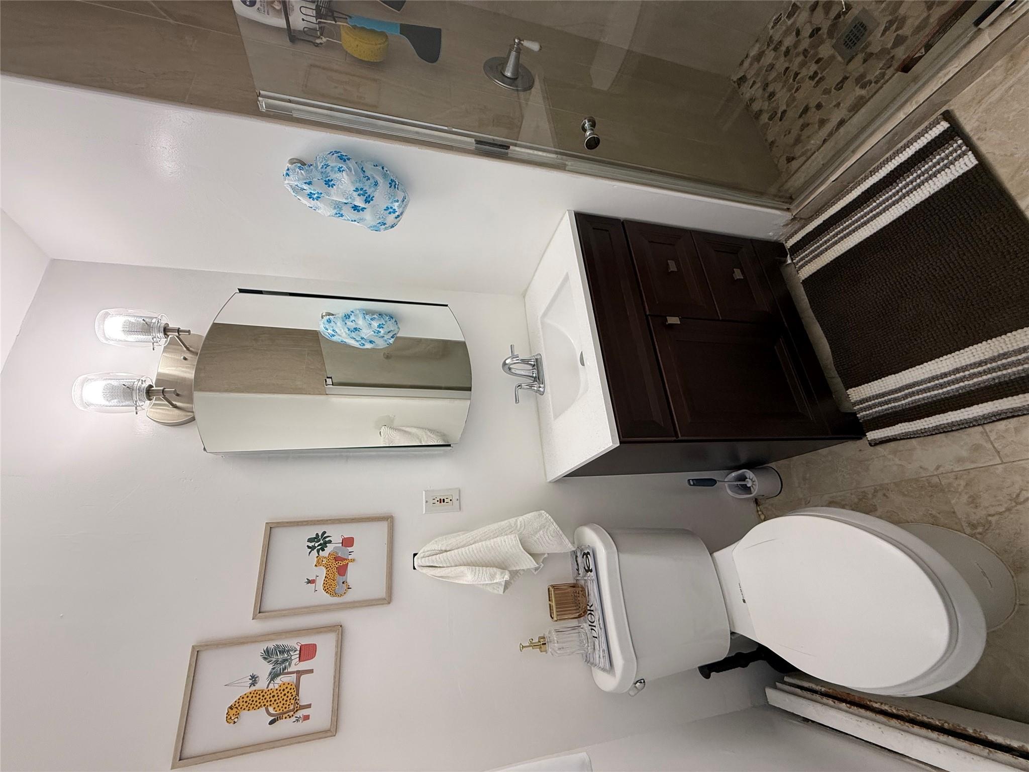 77 Upper Road Middletown, NY 10940 - Photo 9 of 18 Bathroom with vanity, toilet, a shower stall, and a baseboard radiator