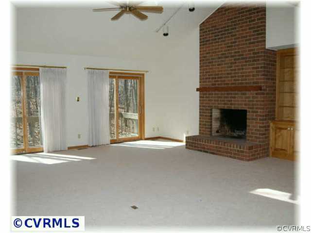 3000 Middlewood Road Midlothian, VA 23113 - Photo 3 of 8 a view of an empty room with a fireplace