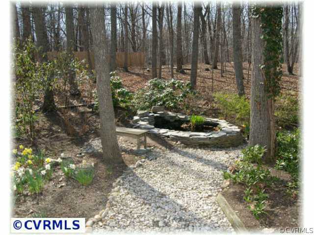 3000 Middlewood Road Midlothian, VA 23113 - Photo 7 of 8 a view of a backyard with pathway