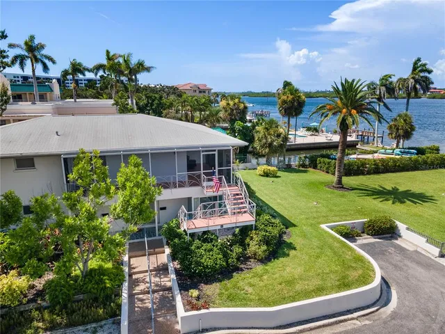 a aerial view of a house with swimming pool garden and patio
