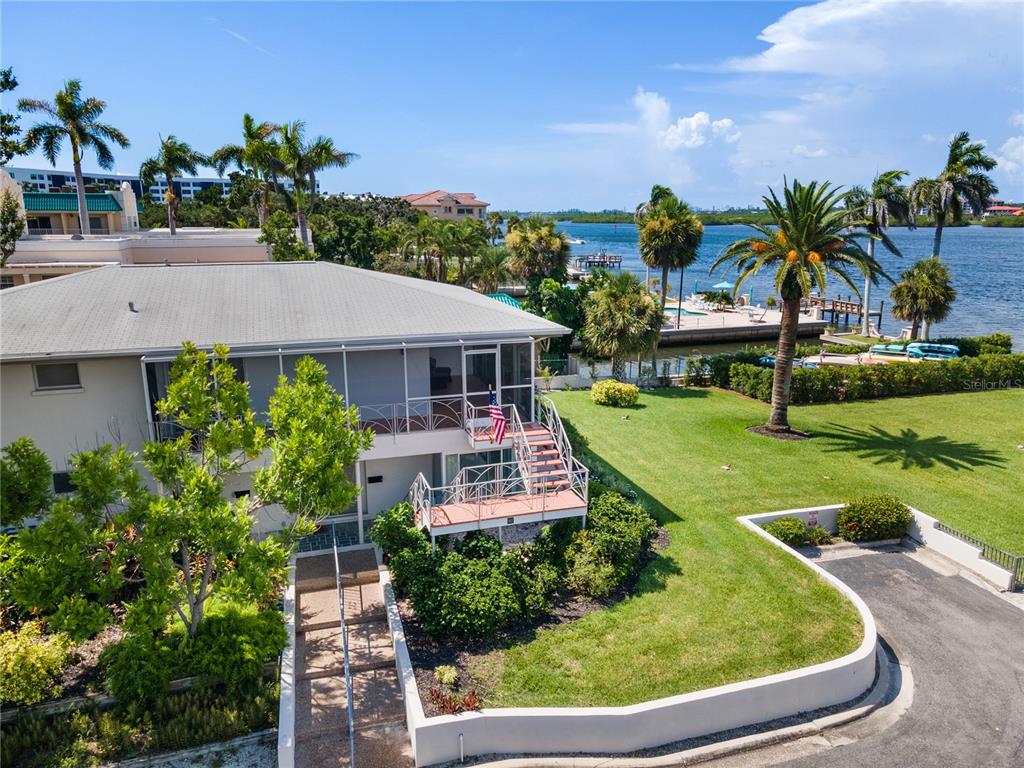 a aerial view of a house with swimming pool garden and patio