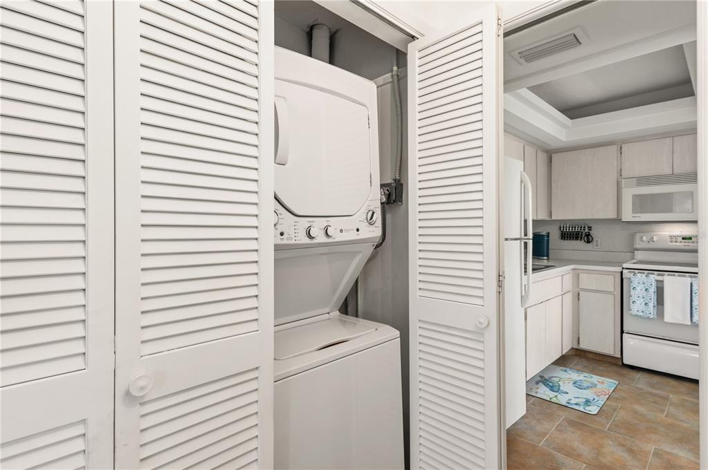 6005 Midnight Pass Road, Unit N13 Sarasota, FL 34242 - Photo 27 of 27 a utility room with dryer and washer