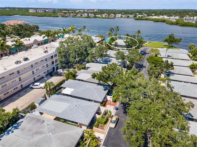 an aerial view of a house with a lake view