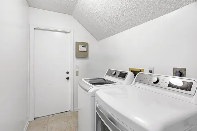 a bedroom with a bed and a table