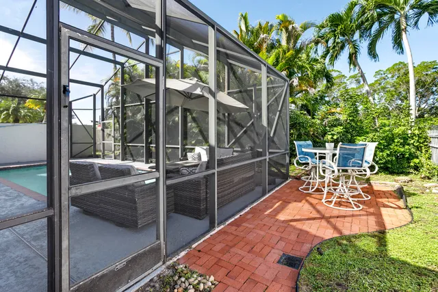 a view of a chairs and table in the patio