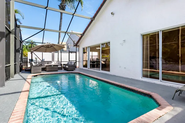 a view of a swimming pool with a patio