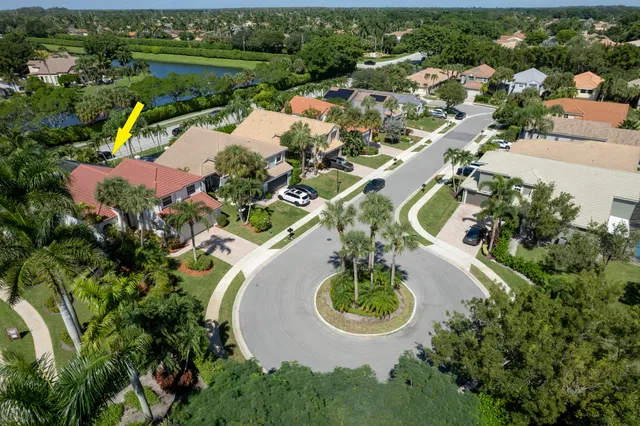 an aerial view of a house with outdoor space and lake view