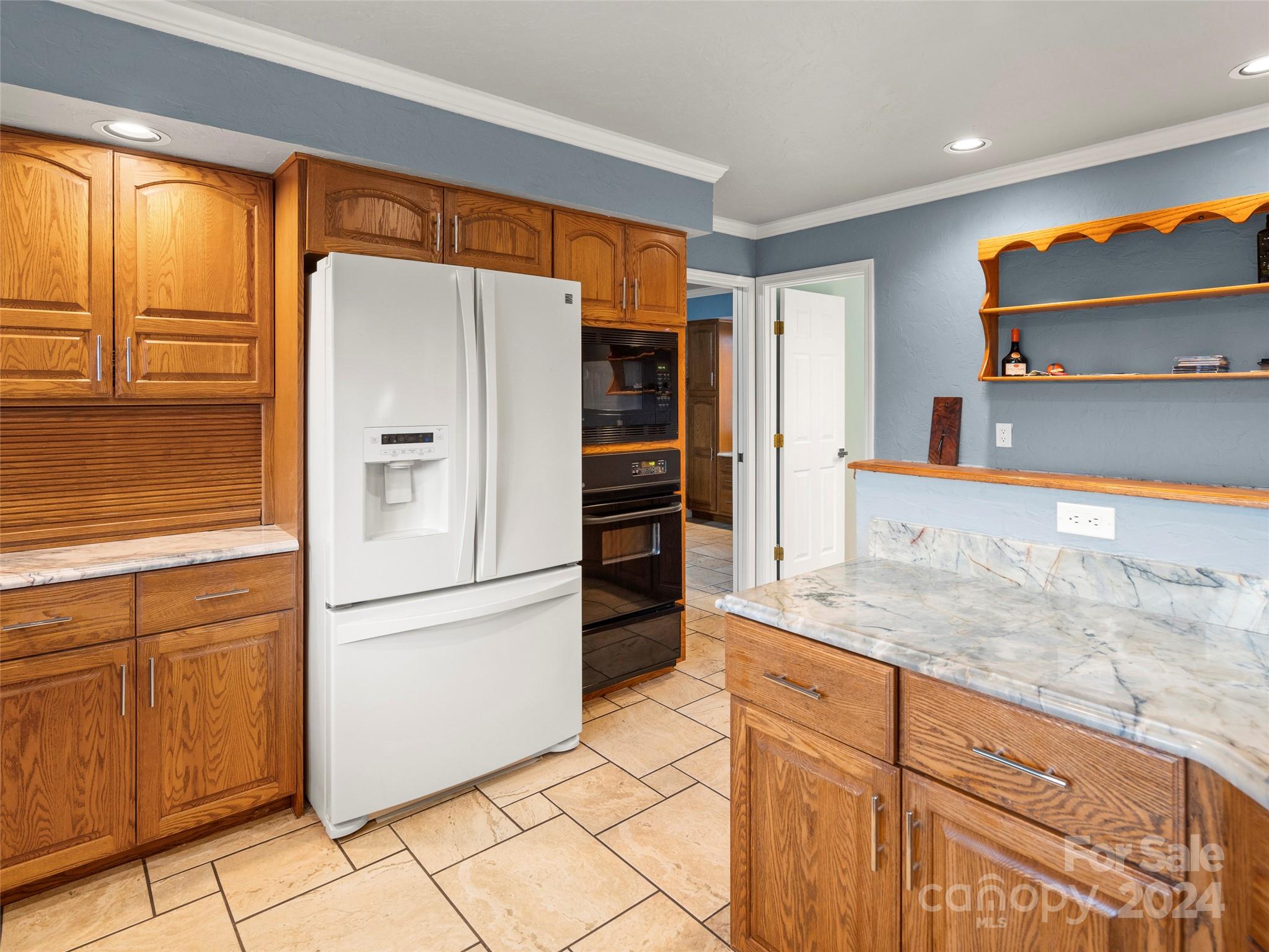 5571 Spring Road Hendersonville, NC 28739 - Photo 14 of 41 a kitchen with stainless steel appliances granite countertop a refrigerator and a sink