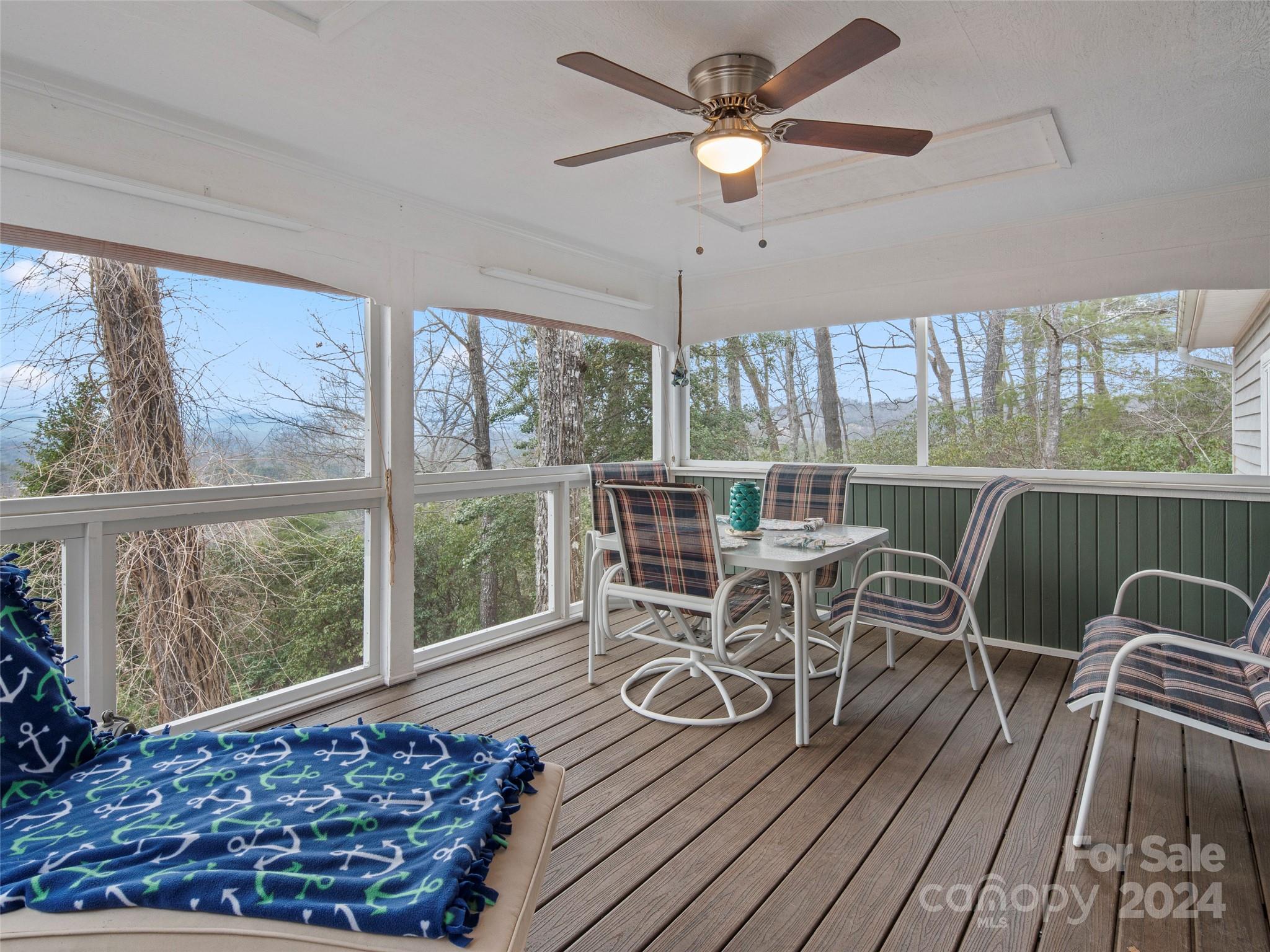 5571 Spring Road Hendersonville, NC 28739 - Photo 19 of 41 a view of a dining room with furniture window and wooden floor
