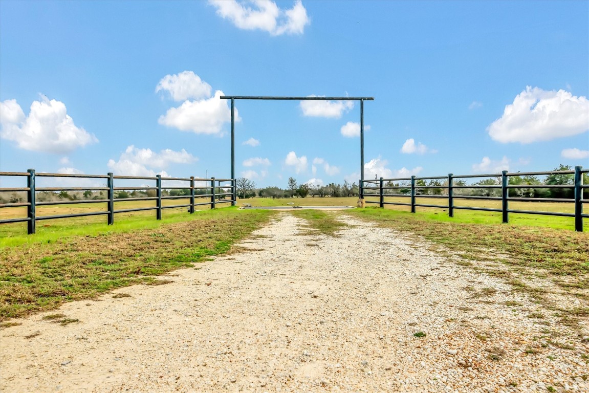 2810 West Old Lockhart Road Muldoon, TX 78949 - Photo 34 of 42 Pipe Fence entrance with cattle guard