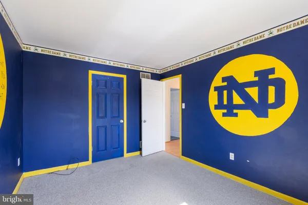 a view of a swimming pool with a chair and window