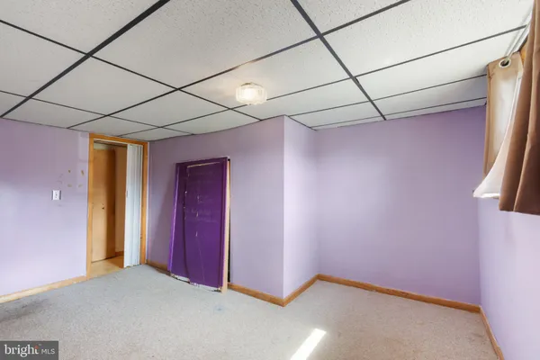 a view of a bathroom from a hallway