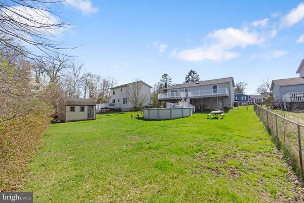 a view of a wooden deck with a yard