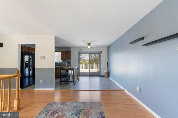a view of a livingroom with furniture and wooden floor