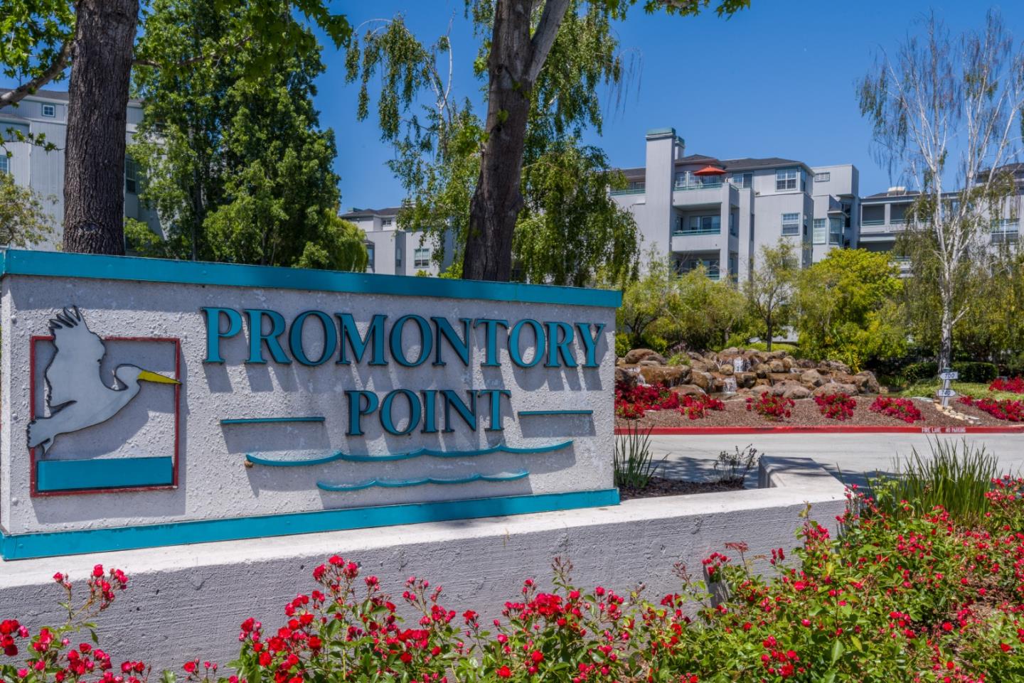 720 Promontory Point Lane, Unit 2106 Foster City, CA 94404 - Photo 2 of 35 a view of a street with flower plants