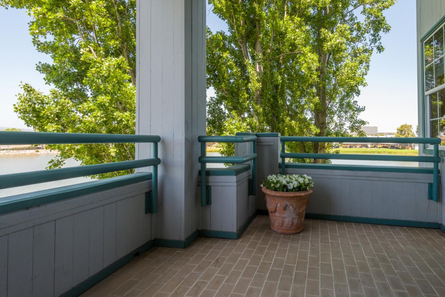 720 Promontory Point Lane, Unit 2106 Foster City, CA 94404 - Photo 26 of 35 a view of a balcony with plants and outdoor seating