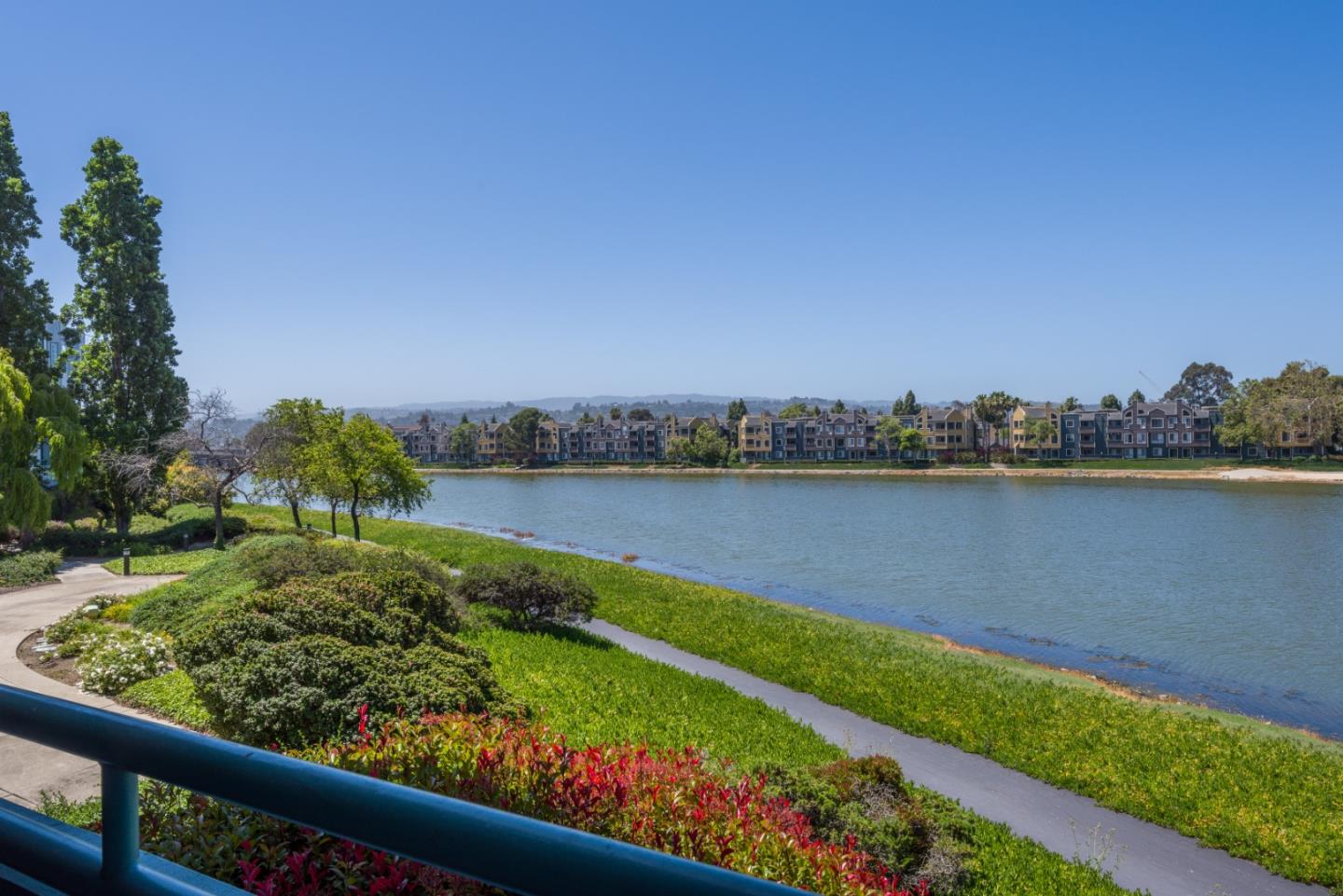 720 Promontory Point Lane, Unit 2106 Foster City, CA 94404 - Photo 28 of 35 a view of a lake with a city view