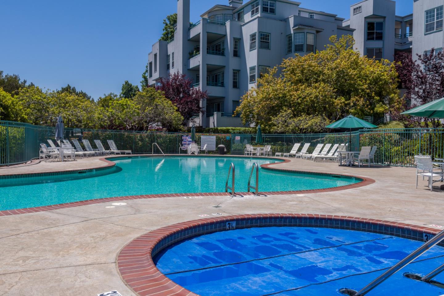 720 Promontory Point Lane, Unit 2106 Foster City, CA 94404 - Photo 30 of 35 a view of a house with a swimming pool