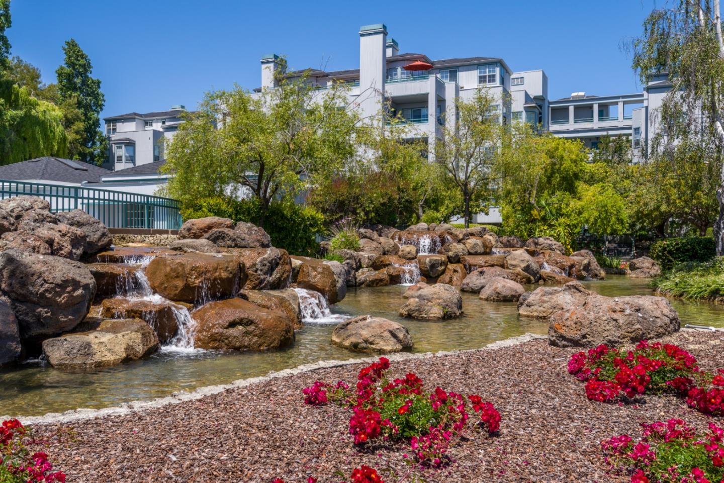 720 Promontory Point Lane, Unit 2106 Foster City, CA 94404 - Photo 3 of 35 a picture of flowers and buildings