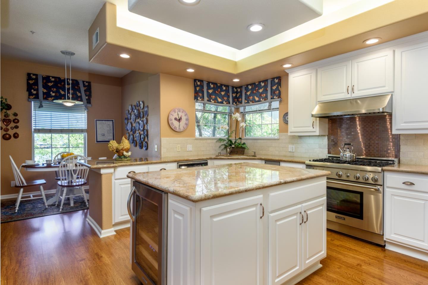 720 Promontory Point Lane, Unit 2106 Foster City, CA 94404 - Photo 9 of 35 a kitchen with a stove sink and cabinets