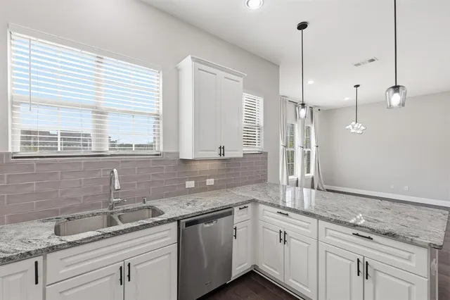 a bathroom with a double vanity sink and mirror