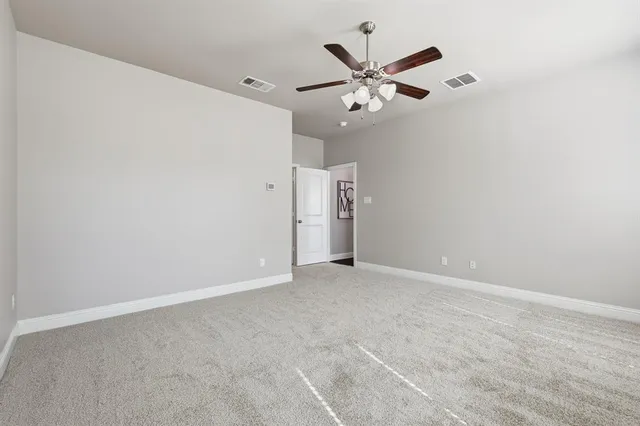 a bedroom with a bed and a tv